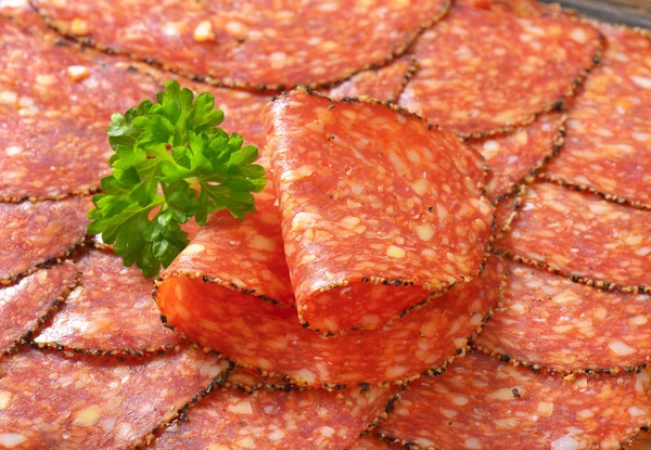 Black pepper-coated salami with cheese — Stock Photo, Image