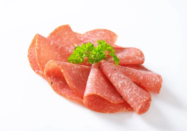 Slices of spicy salami — Stock Photo, Image