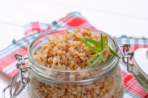 Jar of cooked buckwheat — Stock Photo, Image