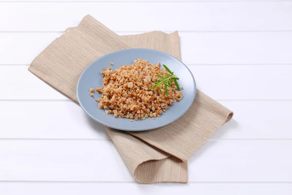 Plate of cooked buckwheat — Stock Photo, Image