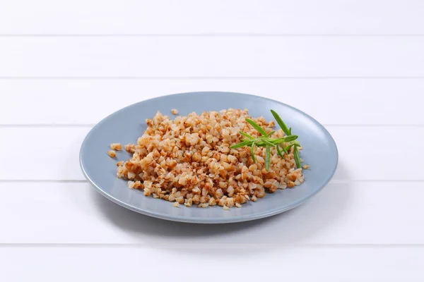Plate of cooked buckwheat — Stock Photo, Image