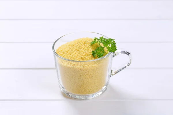 Cup of raw couscous — Stock Photo, Image