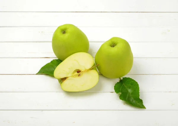 Two and a half green apples — Stock Photo, Image