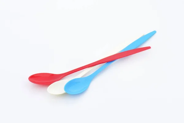 Three long plastic spoons — Stock Photo, Image