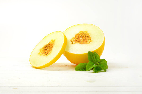 half and slice of yellow melon