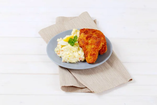 Schnitzels with potato salad — Stock Photo, Image