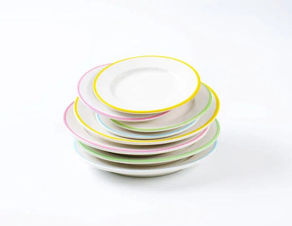 Stack of rimmed plates — Stock Photo, Image