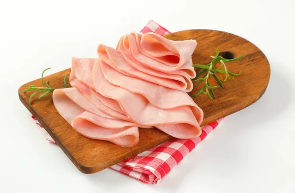 Thin slices of ham and rosemary — Stock Photo, Image