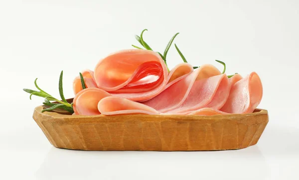 Fette sottili di prosciutto con rosmarino — Foto Stock