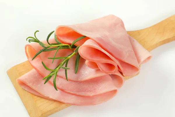 Thin slices of ham and rosemary — Stock Photo, Image