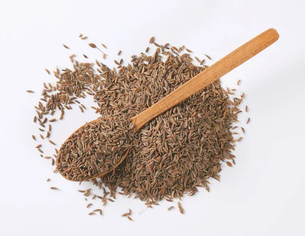 Cumulo e cucchiaio di semi di cumino — Foto Stock