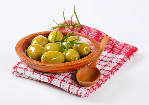 Bowl of green olives with rosemary — Stock Photo, Image