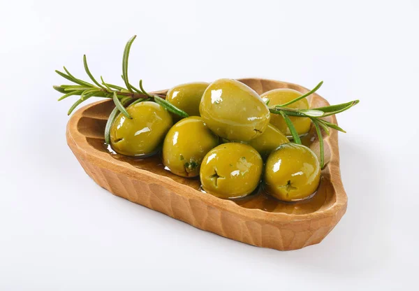 Bowl of green olives with rosemary — Stock Photo, Image