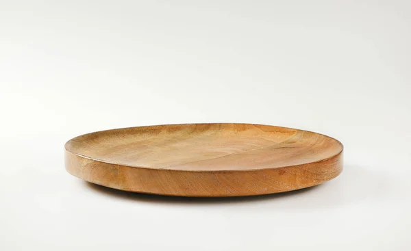 Round wooden serving platter — Stock Photo, Image