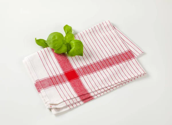 Tea towel and basil leaves — 스톡 사진