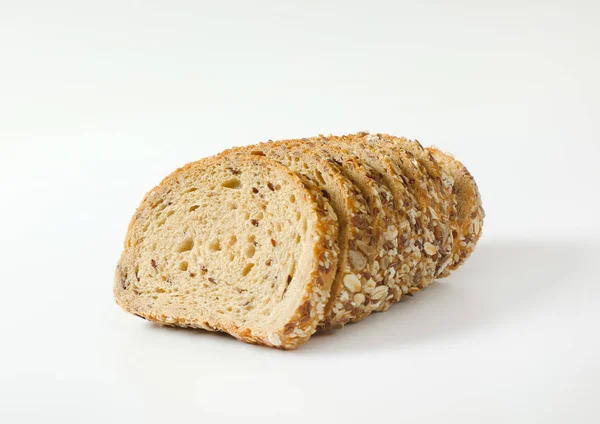 Sliced loaf of whole grain bread — Stock Photo, Image