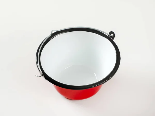 Red and white enamel cauldron / cooking pot with black rim and w — Stock Photo, Image