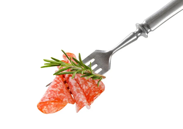 Thin salami slices and rosemary on fork — Stock Photo, Image