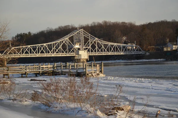 A metal swing bridge across the Ct. river