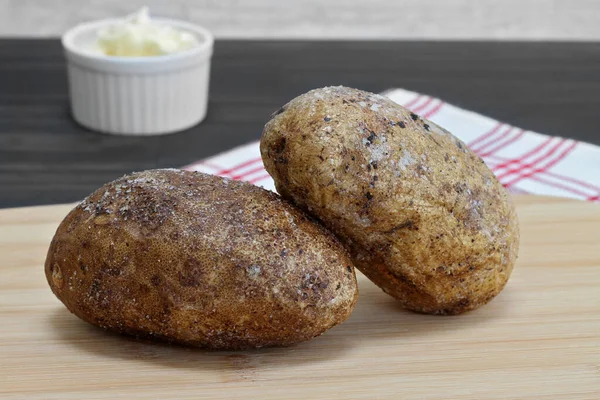 Two Russet Baking Potatoes Coated Sea Salt Fresh Out Oven — Stock Photo, Image