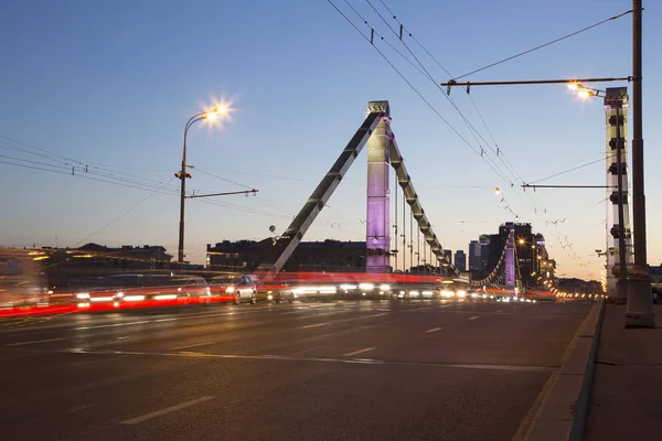 Krymsky Bridge or Crimean Bridge (night) is a steel suspension bridge in Moscow, Russia. The bridge spans the Moskva River 1,800 metres south-west from the Kremlin — Stock Photo, Image