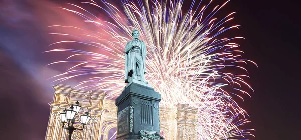 Fireworks over the Moscow city center and a monument to Pushkin on Tverskaya Street at night, Russia