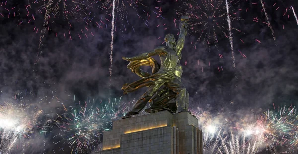 Soviet monument Rabochiy i Kolkhoznitsa ( Worker and Kolkhoz Woman) of sculptor Vera Mukhina (made of in 1937)  and fireworks in honor of Victory Day celebration (WWII), Moscow, Russia