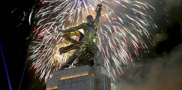 Soviet monument Rabochiy i Kolkhoznitsa ( Worker and Kolkhoz Woman) of sculptor Vera Mukhina (made of in 1937)  and fireworks in honor of Victory Day celebration (WWII), Moscow, Russia