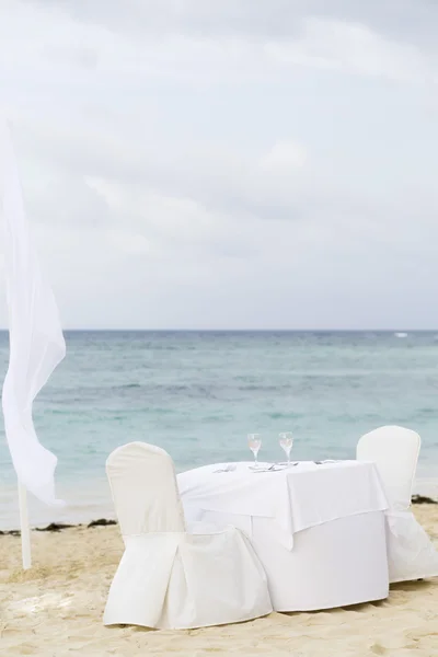 Romantic Table for Two on the Beach Royalty Free Stock Photos