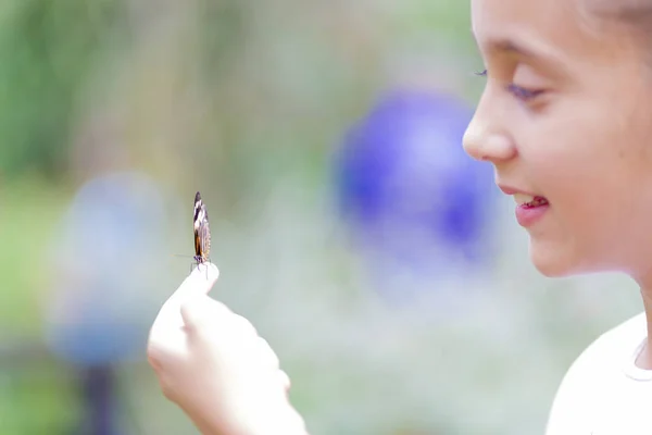 Happy Girl Holding a Butterfly — Stock Photo, Image