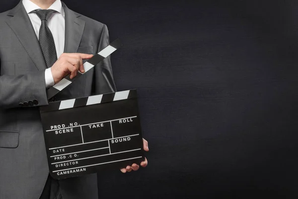 Man holding movie clapper board — Stock Photo, Image