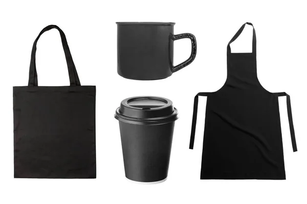 Black apron and kitchen utensils — Stock Photo, Image