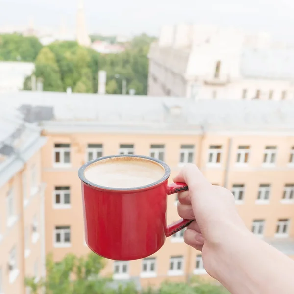 Woman drinking coffee on balcony — Stock Photo, Image