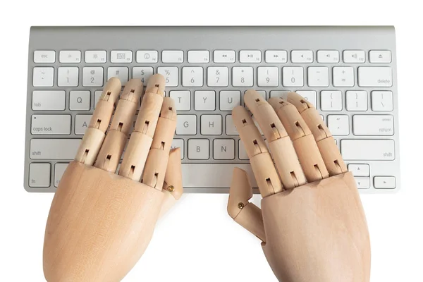 Computer keyboard with wooden dummy hands — Stock Photo, Image