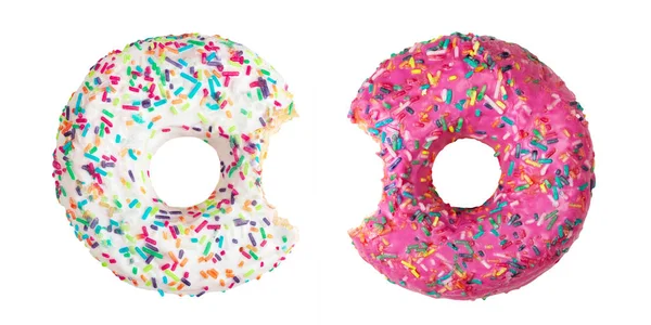 Set van twee gebeten donuts versierd met kleurrijke hagelslag geïsoleerd op wit — Stockfoto