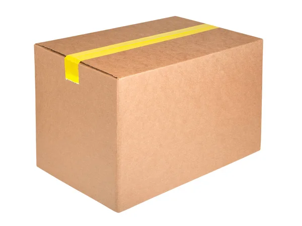 Cardboard box with yellow sticky tape isolated on white background — Stock Photo, Image