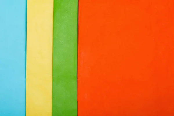 พื้นหลังกระดาษที่มีสีสัน แบนวาง — ภาพถ่ายสต็อก