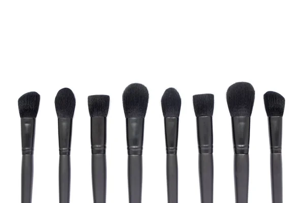 Black makeup brushes isolated on white background — Stock Photo, Image
