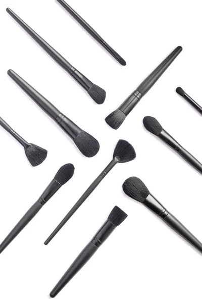 Flat lay of black cosmetic makeup brushes sVertical composition — Stock Photo, Image