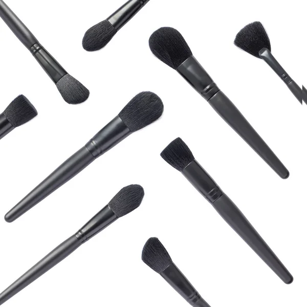 Flat lay of black makeup brushes isolated on white background — Stock Photo, Image