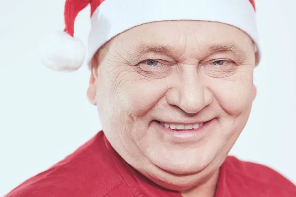 Senior in Santa Claus hat — Stock Photo, Image