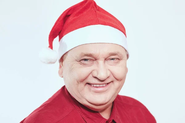 Senior in Santa Claus hat — Stock Photo, Image