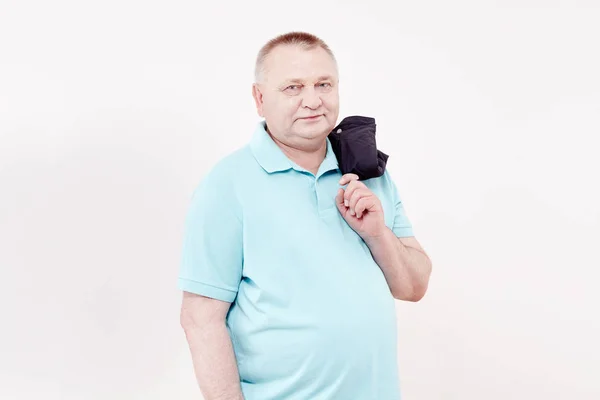 Senior with jacket over shoulder — Stock Photo, Image