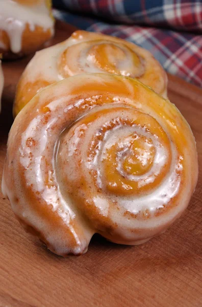 Bun of pumpkin with cinnamon in the form of snails — Stock Photo, Image