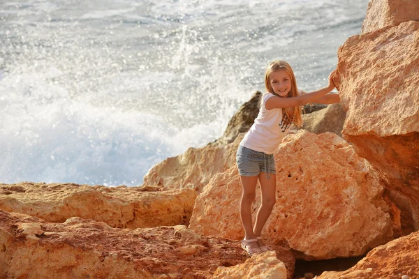 Cute girl among  rocks — Stock Photo, Image