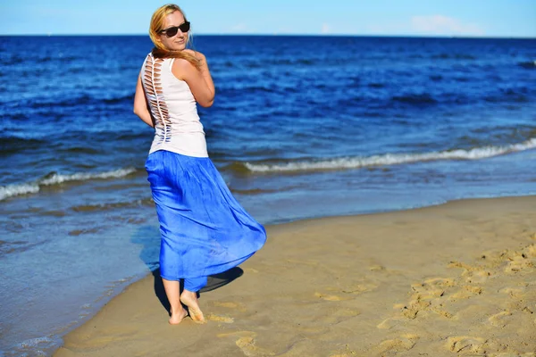 Woman near blue sea — Stock Photo, Image