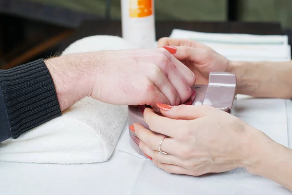 Beautician doing  manicure — Stock Photo, Image