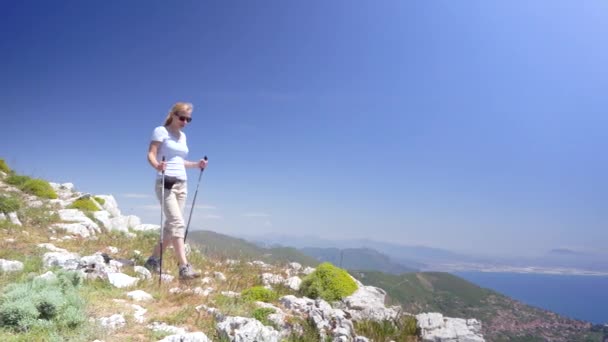 Young woman hiking in mountains over Amalfi coast — Stock Video