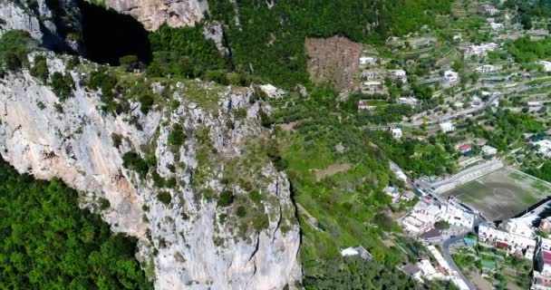 Flying above Montepertuso Hole in Mountain near Poistano in Italy — Stock Video