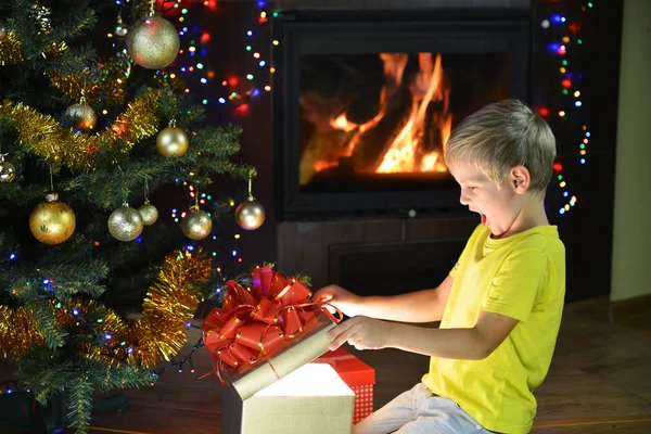 Little boy near Christmas tree Stock Picture